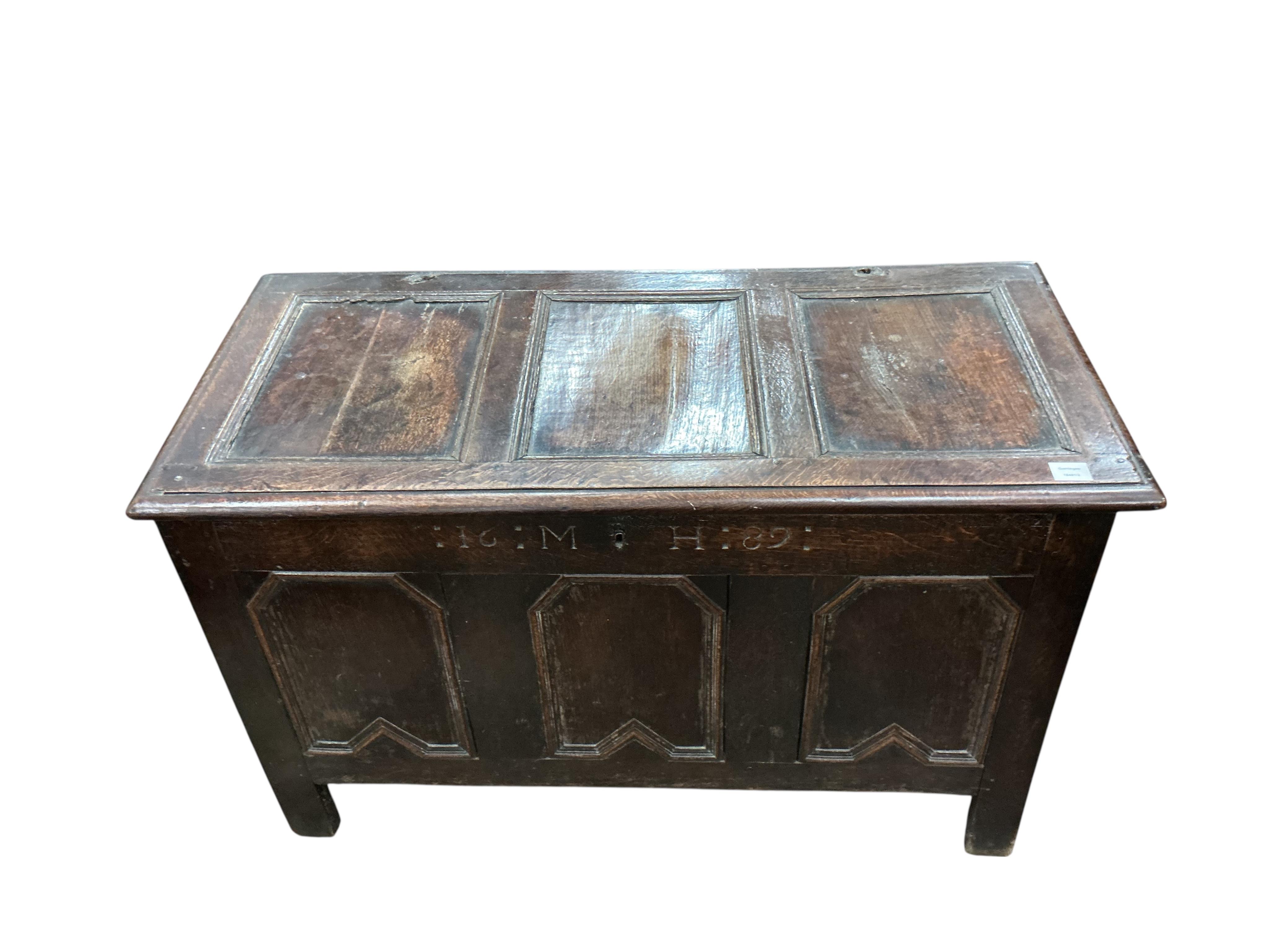 A late 17th century panelled oak coffer, dated 1686, width 116cm, depth 54cm, height 71cm